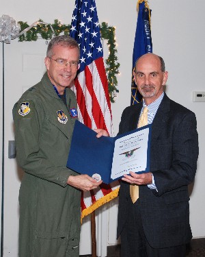 Maj. Gen. Curtis Bedke, USAF (l), commander, Air Force Research Laboratory, Wright-Patterson Air Force Base, Ohio, receives a token of thanks from Dan Curtis, chapter vice president for chapter programs, for serving as the November guest speaker.